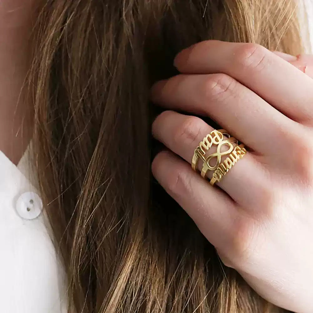 Close-up of a hand with a gold ring on a blurred background. Stainless Steel Name Jewelry. Custom Gift-Personalized. gift for boyfriend / girlfriend. long-distance relationship gift meaningful keepsake. Memory gift. Christmas couple gift. Birthday Gift. Infinity Embrace