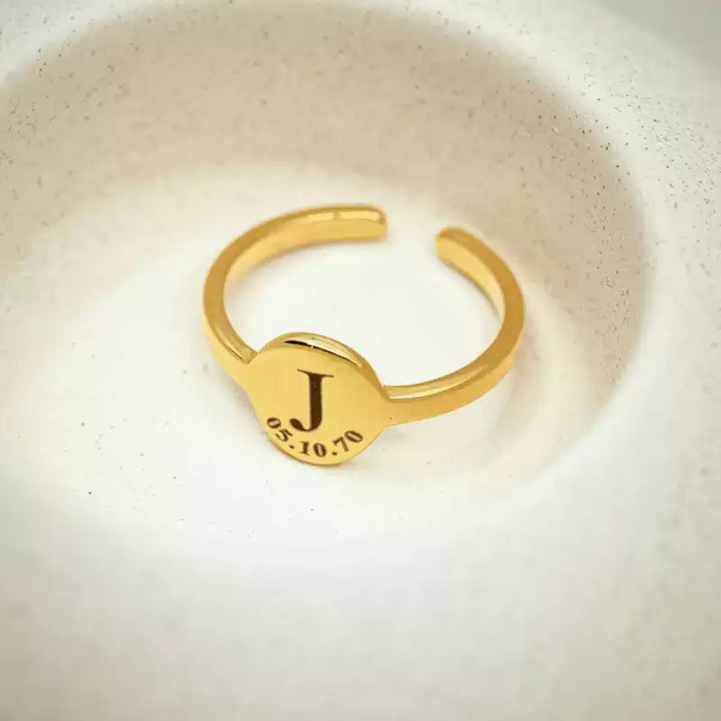 Gold ring with engraved 'J' and date on a white background. Stainless Steel Name Jewelry. Custom Gift-Personalized. gift for boyfriend / girlfriend. long-distance relationship gift meaningful keepsake. Memory gift. Christmas couple gift. Birthday Gift. Circle of Memories.