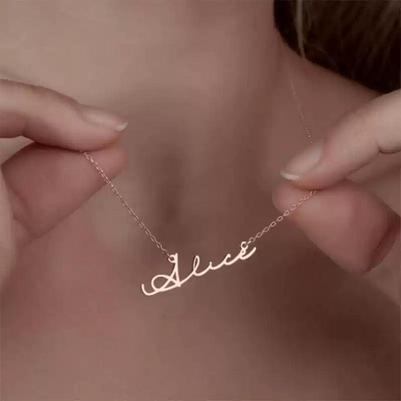 Gold necklace with 'Alice' pendant held by a hand against a neutral background. Stainless Steel Name Jewelry. Custom Gift-Personalized. gift for boyfriend / girlfriend. long-distance relationship gift meaningful keepsake. Memory gift. Christmas couple gift. Birthday Gift. Classic Name Necklace (Circle Chain)