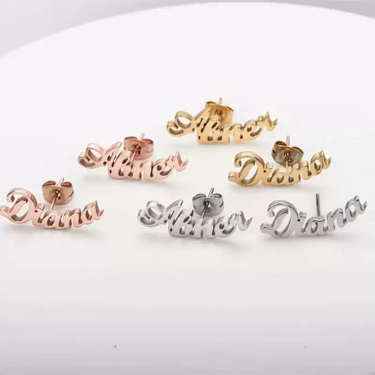 Set of 'Diana' name earrings in gold, rose gold, and silver on a white background, Stainless Steel Name Jewelry. Custom Gift-Personalized. gift for boyfriend / girlfriend. long-distance relationship gift meaningful keepsake. Memory gift. Christmas couple gift. Birthday Gift. Curved SoulName Earrings