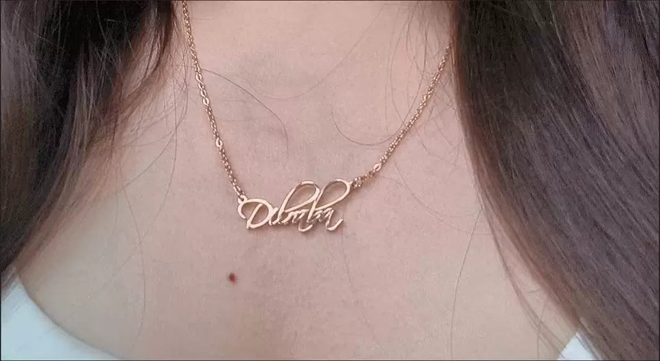 Rose gold necklace with 'Alina' pendant on a person's neck. Stainless Steel Name Jewelry. Custom Gift-Personalized. gift for boyfriend / girlfriend. long-distance relationship gift meaningful keepsake. Memory gift. Christmas couple gift. Birthday Gift. Classic Name Necklace (Circle Chain)