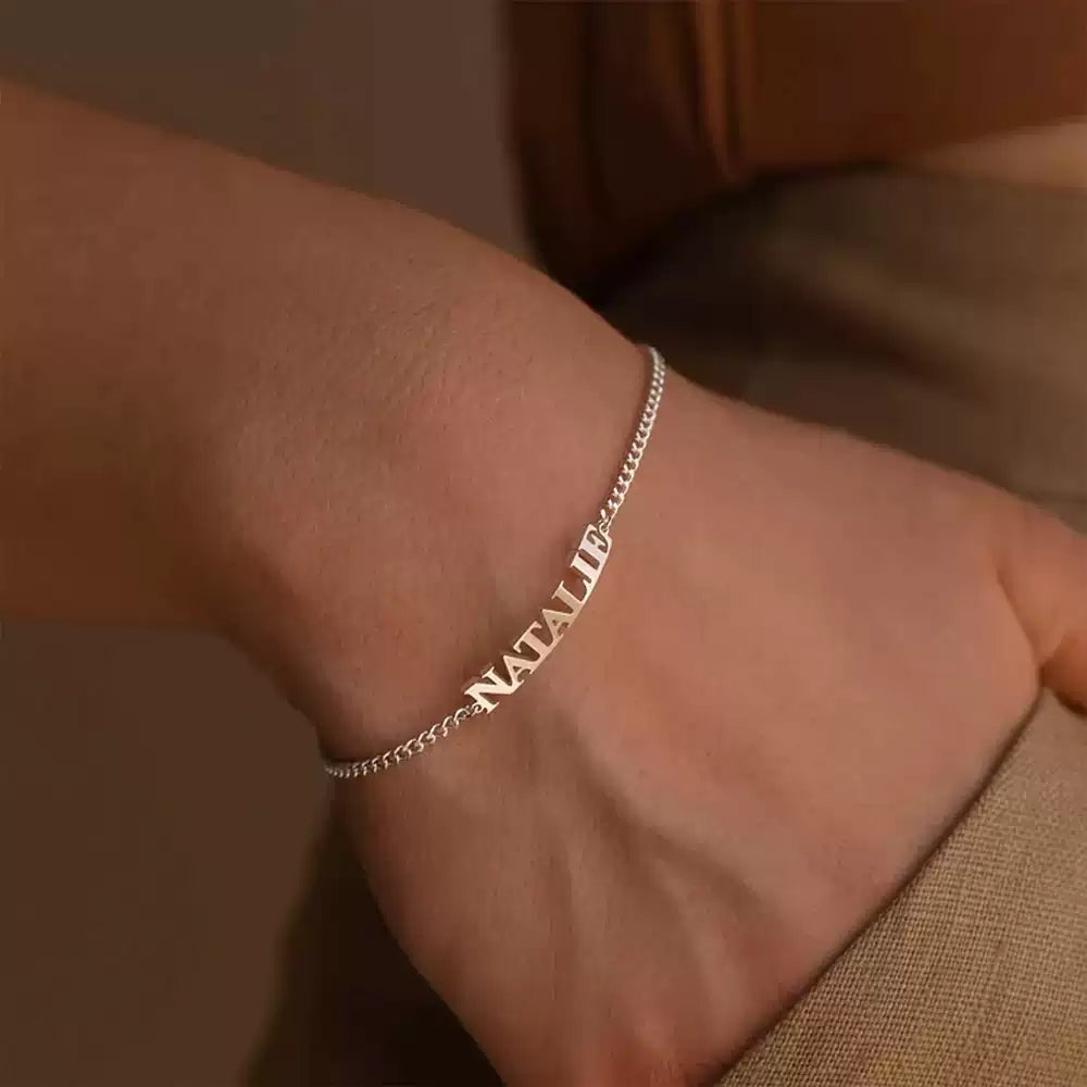 Silver bracelet with 'Natalie' on a wrist against a neutral background. box chain. Stainless Steel Name Jewelry. Custom Gift-Personalized. gift for boyfriend / girlfriend. long-distance relationship gift meaningful keepsake. Memory gift. Christmas couple gift. Birthday Gift. 