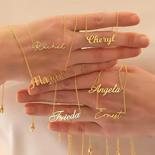Gold name necklaces on a hand with a beige background. Stainless Steel Name Jewelry. Custom Gift-Personalized. gift for boyfriend / girlfriend. long-distance relationship gift meaningful keepsake. Memory gift. Christmas couple gift. Birthday Gift. 