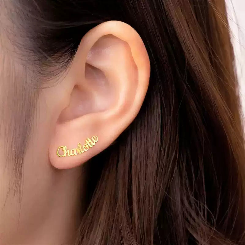 Gold earring with 'Charlotte' engraved on an ear Stainless Steel Name Jewelry. Custom Gift-Personalized. gift for boyfriend / girlfriend. long-distance relationship gift meaningful keepsake. Memory gift. Christmas couple gift. Birthday Gift. Curved SoulName Earrings