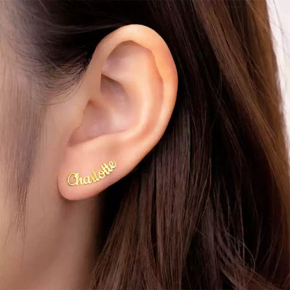 Gold earring with 'Charlotte' engraved on an ear Stainless Steel Name Jewelry. Custom Gift-Personalized. gift for boyfriend / girlfriend. long-distance relationship gift meaningful keepsake. Memory gift. Christmas couple gift. Birthday Gift. Curved SoulName Earrings