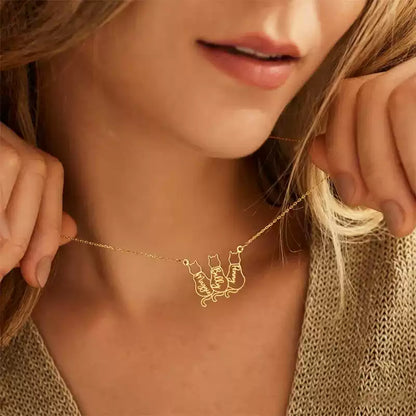 Gold necklace with cat-shaped pendants worn by a person. Stainless Steel Name Jewelry. Custom Gift-Personalized. gift for boyfriend / girlfriend. long-distance relationship gift meaningful keepsake. Memory gift. Christmas couple gift. Birthday Gift. Baby Cat Necklace. 