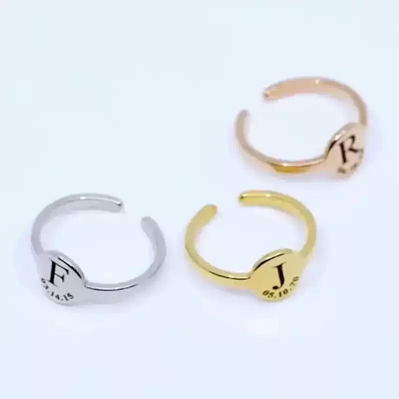 Three gold and silver rings with engraved text on a white background. Stainless Steel Name Jewelry. Custom Gift-Personalized. gift for boyfriend / girlfriend. long-distance relationship gift meaningful keepsake. Memory gift. Christmas couple gift. Birthday Gift. Circle of Memories. 