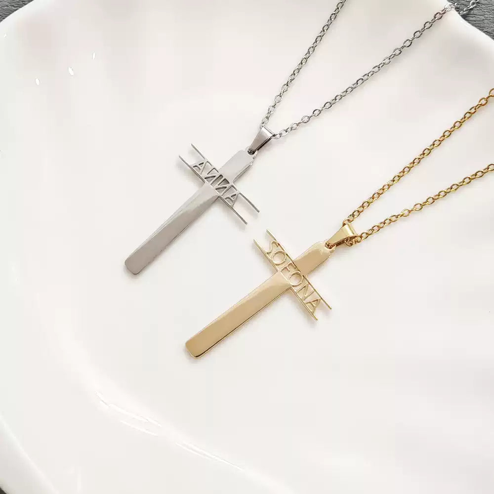 Two cross-shaped necklaces, one gold and one silver, on a white surface.. Stainless Steel Name Jewelry. Custom Gift-Personalized. gift for boyfriend / girlfriend. long-distance relationship gift meaningful keepsake. Memory gift. Christmas couple gift. Birthday Gift. Hollow Letter Cross Necklace