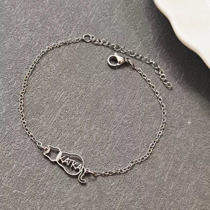 Silver bracelet with 'Katka' charm on a gray surface. Cat with name. Stainless Steel Name Jewelry. Custom Gift-Personalized. gift for boyfriend / girlfriend. long-distance relationship gift meaningful keepsake. Memory gift. Christmas couple gift. Birthday Gift. 