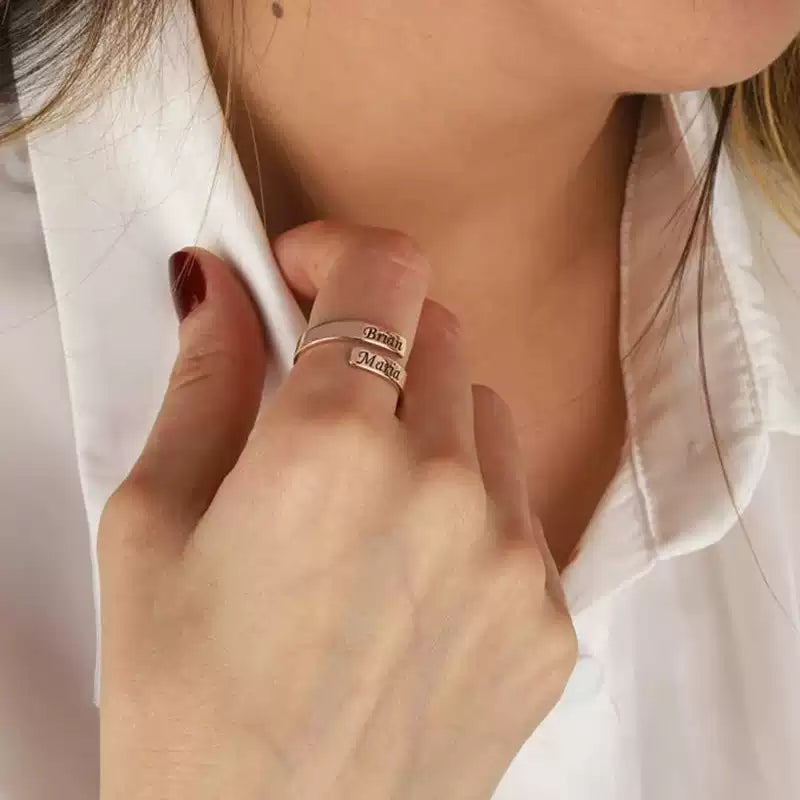 Close-up of a person wearing a ring with engraved text, set against a blurred background. Stainless Steel Name Jewelry. Custom Gift-Personalized. gift for boyfriend / girlfriend. long-distance relationship gift meaningful keepsake. Memory gift. Christmas couple gift. Birthday Gift. Timeless Engrave