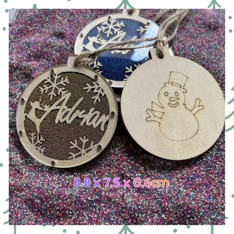 Two wooden Christmas ornaments with engraved names and designs on a glittery background. custom Christmas Gift