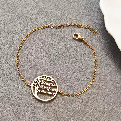 Gold bracelet with a tree-shaped charm on a gray surface. Stainless Steel Name Jewelry. Custom Gift-Personalized. gift for boyfriend / girlfriend. long-distance relationship gift meaningful keepsake. Memory gift. Christmas couple gift. Birthday Gift. 