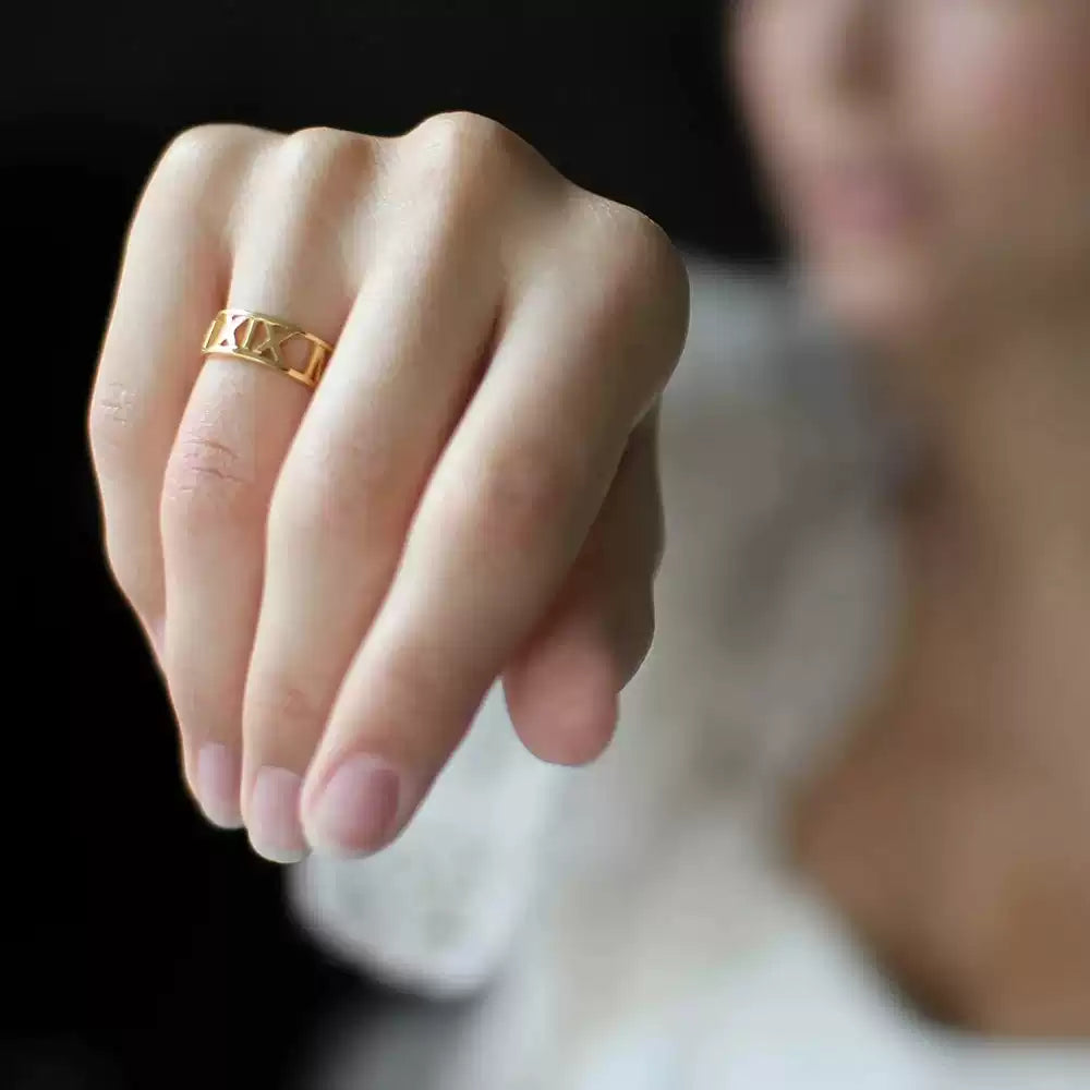 Gold ring on a finger with a blurred background. Stainless Steel Name Jewelry. Custom Gift-Personalized. gift for boyfriend / girlfriend. long-distance relationship gift meaningful keepsake. Memory gift. Christmas couple gift. Birthday Gift. Bold Initial Frame
