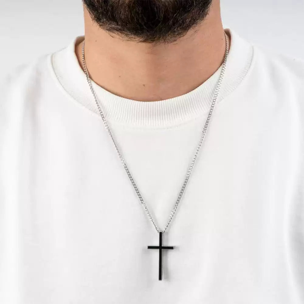 Person wearing a necklace with a black cross pendant on a white background. Stainless Steel Name Jewelry. Custom Gift-Personalized. gift for boyfriend / girlfriend. long-distance relationship gift meaningful keepsake. Memory gift. Christmas couple gift. Birthday Gift. Men’s Black Cross Name Necklace