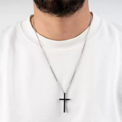Person wearing a necklace with a black cross pendant on a white background. Stainless Steel Name Jewelry. Custom Gift-Personalized. gift for boyfriend / girlfriend. long-distance relationship gift meaningful keepsake. Memory gift. Christmas couple gift. Birthday Gift. Men’s Black Cross Name Necklace