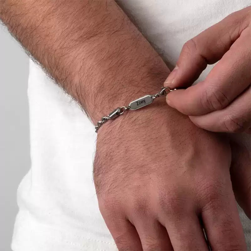 Person wearing a silver bracelet on a plain background. Rope Chain. Stainless Steel Name Jewelry. Custom Gift-Personalized. gift for boyfriend / girlfriend. long-distance relationship gift meaningful keepsake. Memory gift. Christmas couple gift. Birthday Gift. 