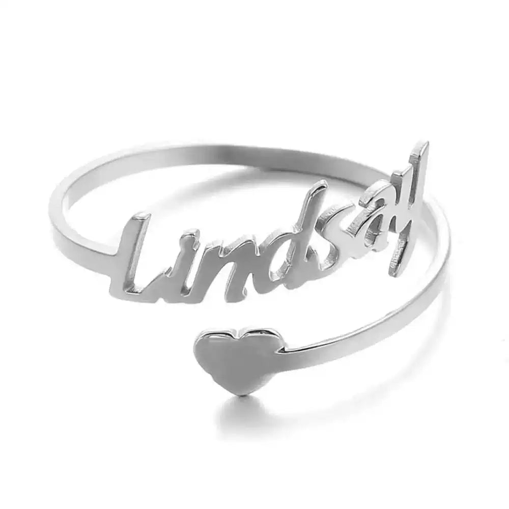 Silver ring with 'Lindsay' engraved on a white background. Stainless Steel Name Jewelry. Custom Gift-Personalized. gift for boyfriend / girlfriend. long-distance relationship gift meaningful keepsake. Memory gift. Christmas couple gift. Birthday Gift. 
