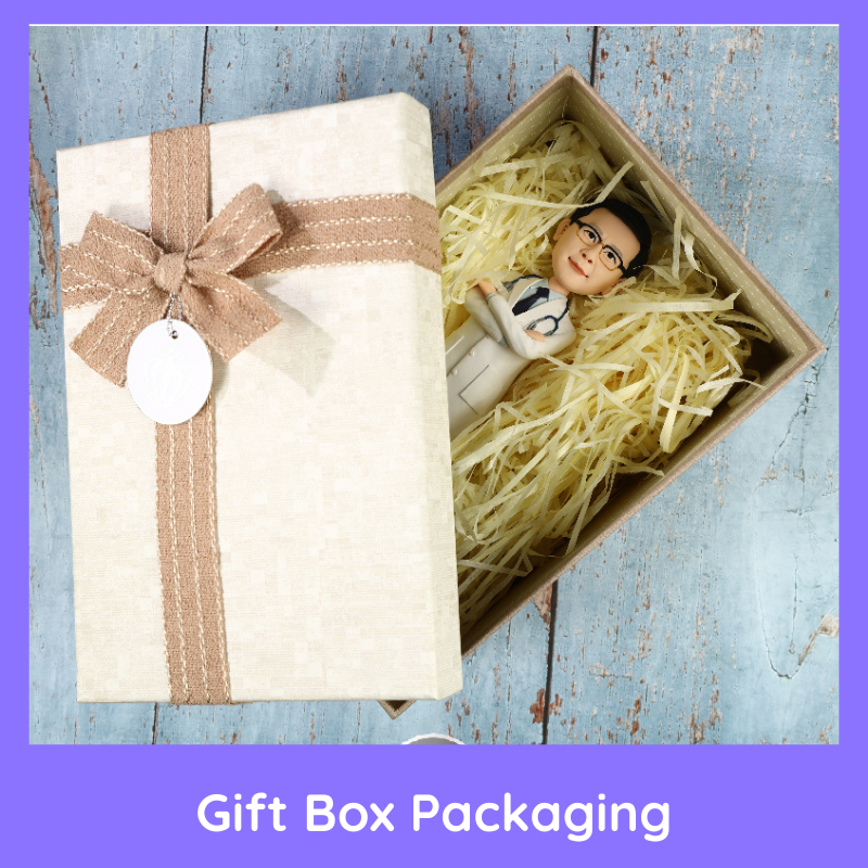 Gift box with decorative bow and toy figure on a wooden surface. Personalized couple present. Gift for boyfriend girlfriend. Custom-made. Personalized. Perfect gift idea. Meaningful keepsake. Wedding gift. Anniversary gift. Birthday gift