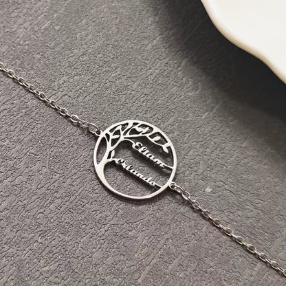 Silver bracelet with tree design and engraved names on a gray textured surface. Stainless Steel Name Jewelry. Custom Gift-Personalized. gift for boyfriend / girlfriend. long-distance relationship gift meaningful keepsake. Memory gift. Christmas couple gift. Birthday Gift. 