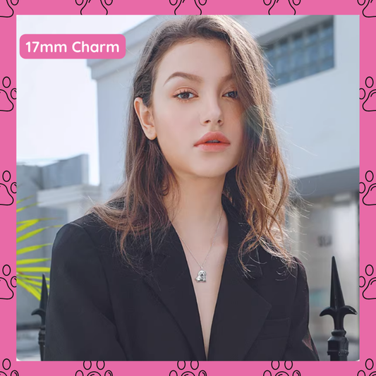 A young woman wearing a necklace , front face with a pink border and '17mm dog Charm. 