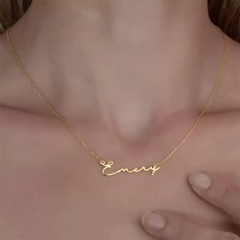 Gold necklace with 'Emeric' pendant on a person's neck. Stainless Steel Name Jewelry. Custom Gift-Personalized. gift for boyfriend / girlfriend. long-distance relationship gift meaningful keepsake. Memory gift. Christmas couple gift. Birthday Gift. Classic Name Necklace (Circle Chain)