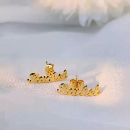 Gold 'Rachel' name earrings on a soft white background. Stainless Steel Name Jewelry. Custom Gift-Personalized. gift for boyfriend / girlfriend. long-distance relationship gift meaningful keepsake. Memory gift. Christmas couple gift. Birthday Gift. Curved SoulName Earrings