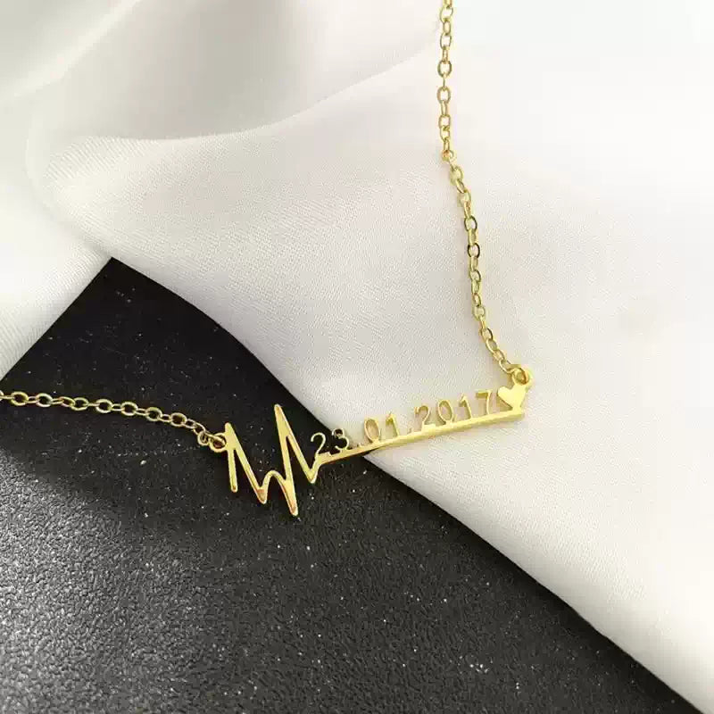 Gold necklace with a heart rate design and date on a black and white background Stainless Steel Name Jewelry. Custom Gift-Personalized. gift for boyfriend / girlfriend. long-distance relationship gift meaningful keepsake. Memory gift. Christmas couple gift. Birthday Gift. Memorable Date Necklace