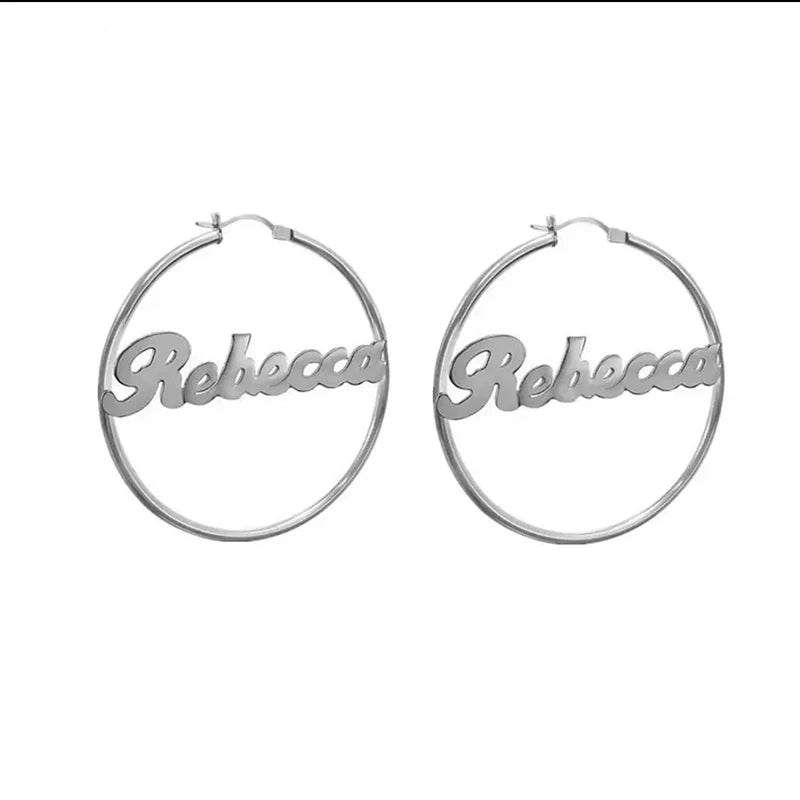 Silver hoop earrings with 'Rebecca' engraving on a white background Stainless Steel Name Jewelry. Custom Gift-Personalized. gift for boyfriend / girlfriend. long-distance relationship gift meaningful keepsake. Memory gift. Christmas couple gift. Birthday Gift. Retro Classic Hoop Name Earrings