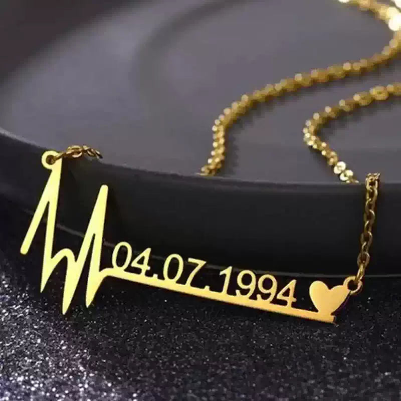Gold necklace with a heart rate design and date '04.07.1994' on a dark . Stainless Steel Name Jewelry. Custom Gift-Personalized. gift for boyfriend / girlfriend. long-distance relationship gift meaningful keepsake. Memory gift. Christmas couple gift. Birthday Gift. Memorable Date Necklace