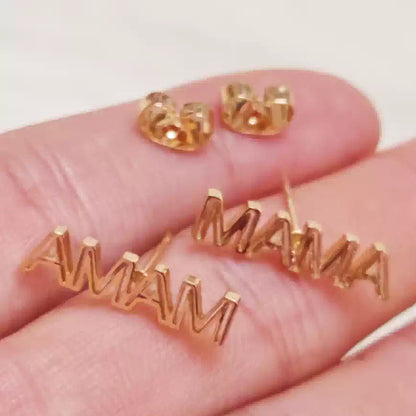 Gold 'MAMA' letter earrings on a hand against a white background Stainless Steel Name Jewelry. Custom Gift-Personalized. gift for boyfriend / girlfriend. long-distance relationship gift meaningful keepsake. Memory gift. Christmas couple gift. Birthday Gift. Hollow Line Name Studs