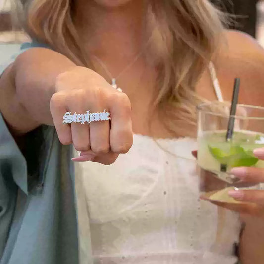 Person wearing a ring with 'Superstar' on a blurred background. Double hole rings. Stainless Steel Name Jewelry. Custom Gift-Personalized. gift for boyfriend / girlfriend. long-distance relationship gift meaningful keepsake. Memory gift. Christmas couple gift. Birthday Gift. 