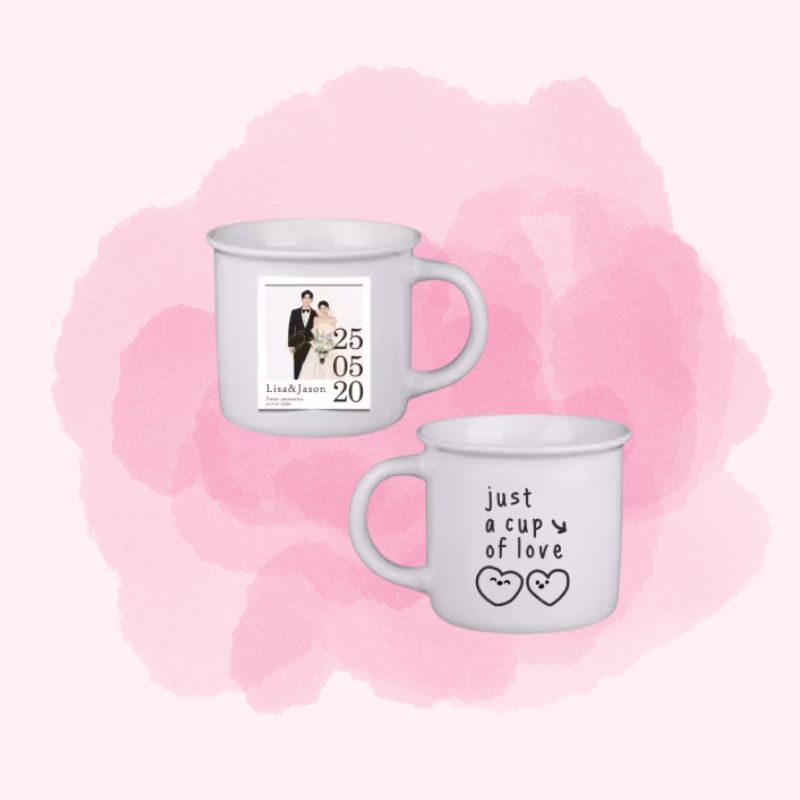 Two mugs with personalized designs on a pink watercolor background
