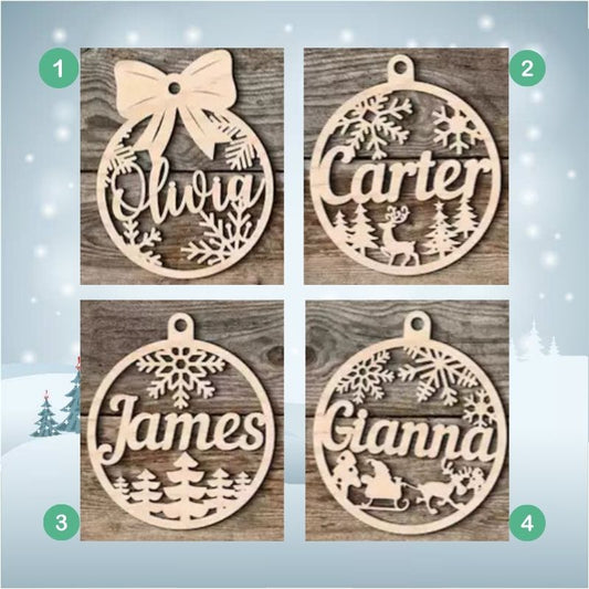 Four wooden Christmas ornaments with names engraved on a snowy background