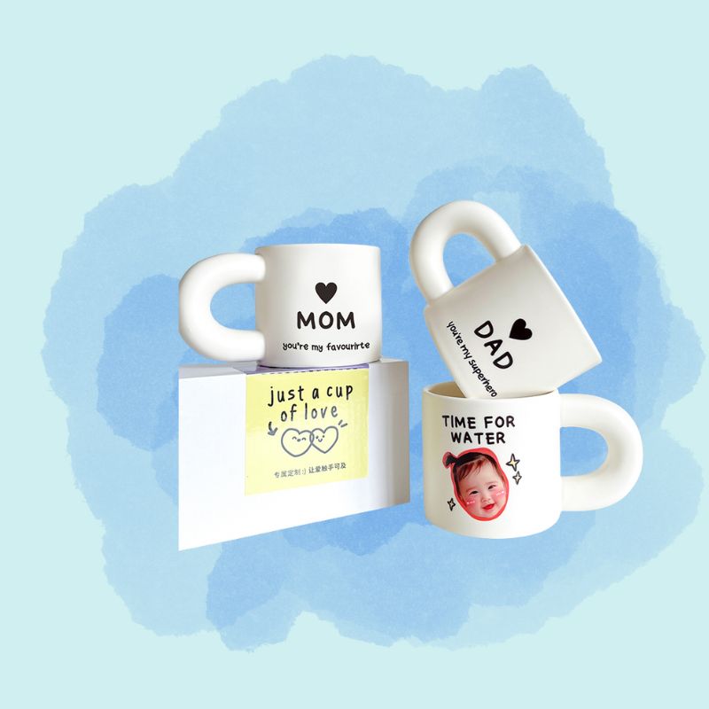 Three mugs with personalized text on a light blue background