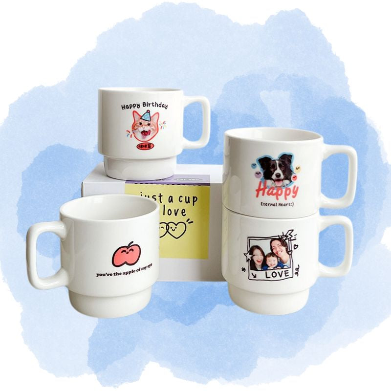 Set of personalized mugs with various designs on a light blue background