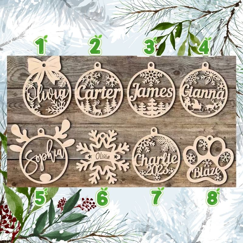 Wooden Christmas ornaments with names on a wooden board with a snowy background