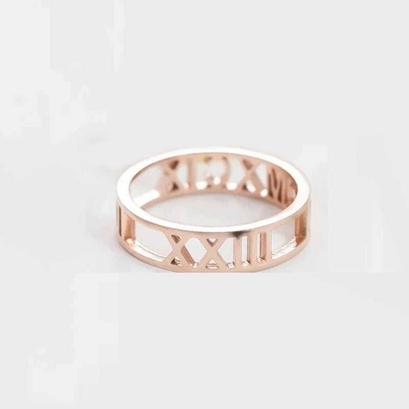 Rose gold ring with Roman numeral design on a light gray background. Stainless Steel Name Jewelry. Custom Gift-Personalized. gift for boyfriend / girlfriend. long-distance relationship gift meaningful keepsake. Memory gift. Christmas couple gift. Birthday Gift. Bold Initial Frame