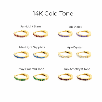 Collection of gold hoop earrings with colored stones for each month, labeled '14K Gold Tone'.