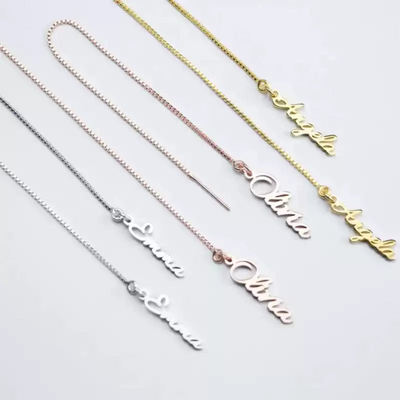 Necklace with 'Olivia' engraving in various colors on a light gray  Stainless Steel Name Jewelry. Custom Gift-Personalized. gift for boyfriend / girlfriend. long-distance relationship gift meaningful keepsake. Memory gift. Christmas couple gift. Birthday Gift. Vertical Chain Threader Earringsbackground
