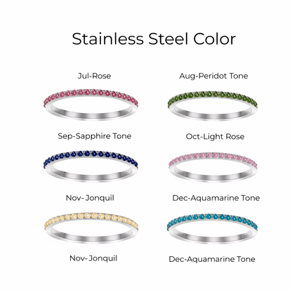 Stainless steel rings with colored gemstones on a white background